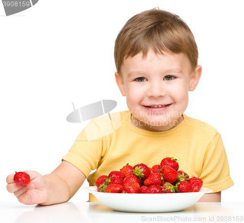 Image of Little boy with strawberries