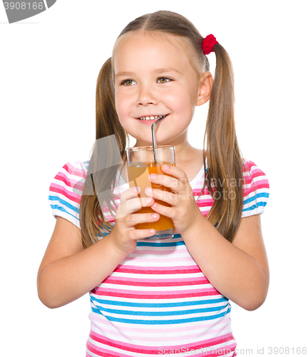 Image of Little girl is drinking carrot juice