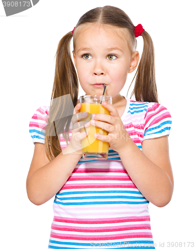 Image of Little girl is drinking orange juice