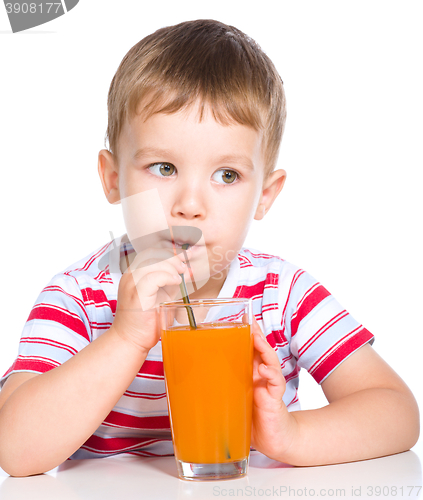 Image of Little boy with glass of carrot juice