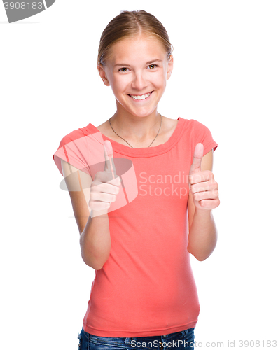 Image of Young girl is showing thumb up gesture