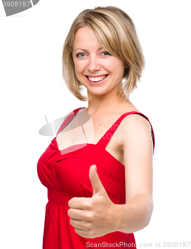 Image of Woman is showing thumb up gesture