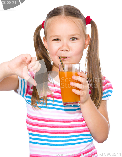 Image of Little girl is drinking carrot juice