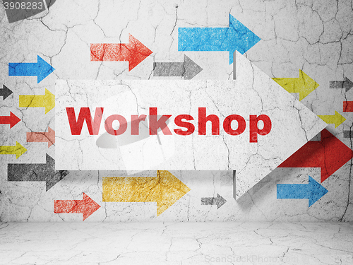 Image of Education concept: arrow with Workshop on grunge wall background