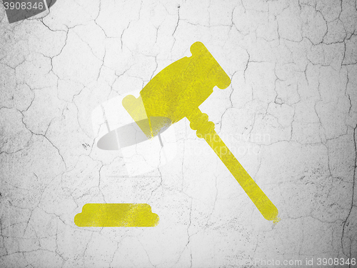 Image of Law concept: Gavel on wall background