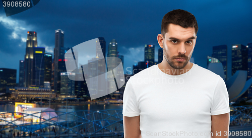 Image of young man portrait over gray background