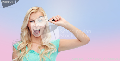 Image of happy young woman with magnifying glass