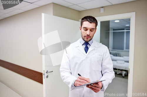 Image of doctor with clipboard at hospital