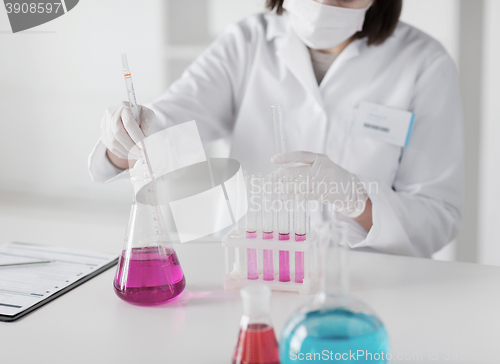 Image of close up of scientist making test in lab