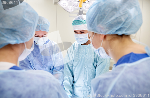 Image of group of surgeons in operating room at hospital