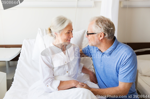 Image of senior couple meeting at hospital ward