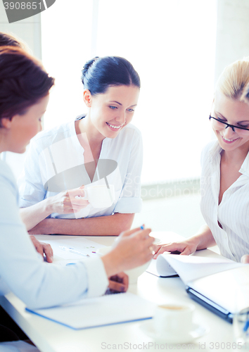 Image of businesswoman with team on meeting in office