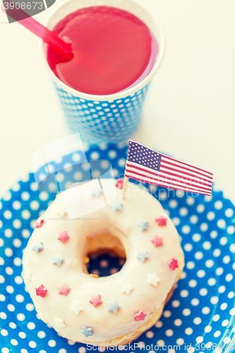 Image of donut with juice and american flag decoration