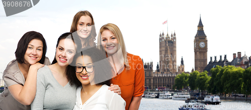 Image of group of happy different women over london city