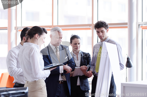 Image of young startup businessman making presentation to senior investio