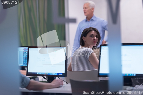Image of technology students group working in computer lab school  classr