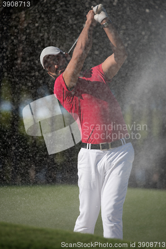 Image of golfer hitting a sand bunker shot