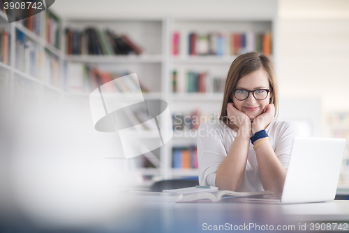 Image of female student study in school library