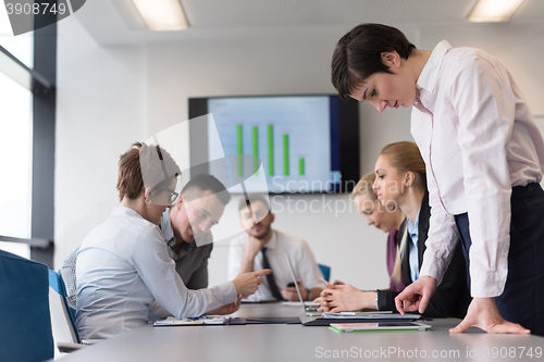 Image of young  woman using  tablet on business meeting