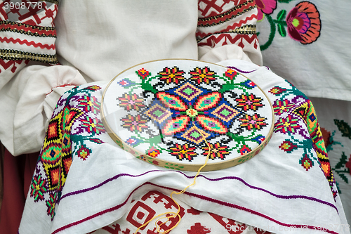 Image of Crafts: beautiful embroidered tablecloth in the process of embro