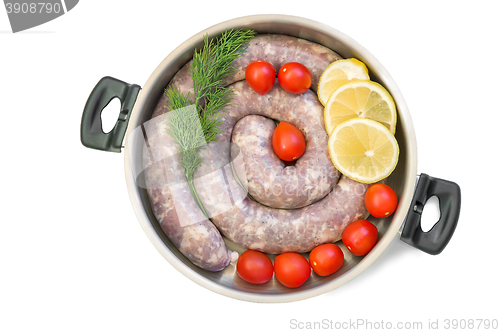 Image of Homemade pork sausage in a frying pan for a roast.