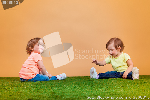 Image of Happy funny girl twins sisters playing and laughing