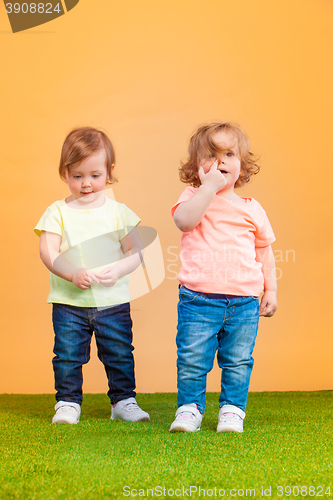 Image of Happy funny girl twins sisters playing and laughing