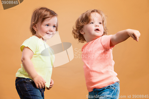 Image of Happy funny girl twins sisters playing and laughing