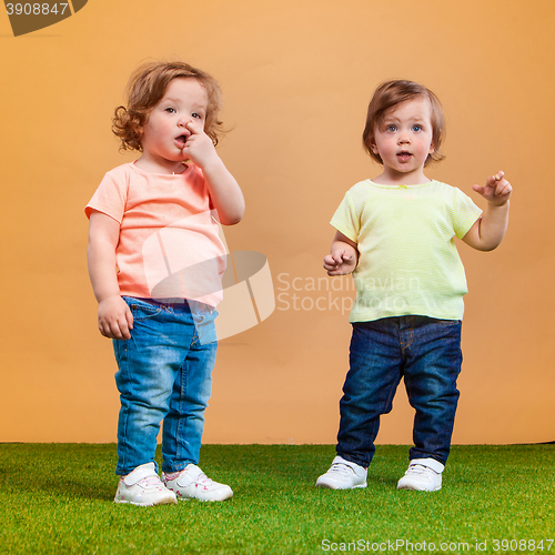 Image of Happy funny girl twins sisters playing and laughing