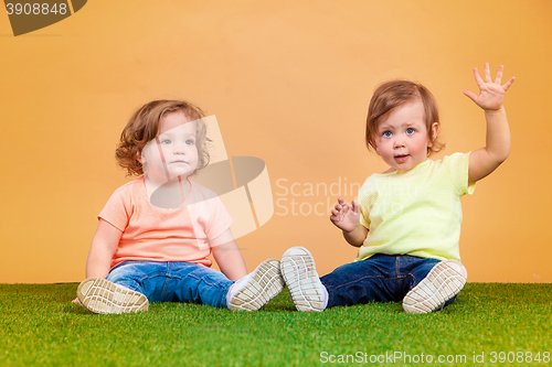 Image of Happy funny girl twins sisters playing and laughing