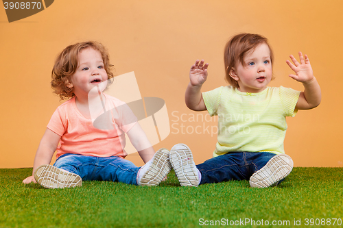 Image of Happy funny girl twins sisters playing and laughing