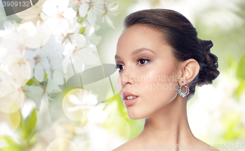 Image of close up of beautiful woman face with earring