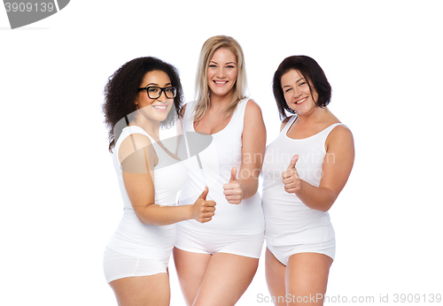 Image of group of happy plus size women showing thumbs up