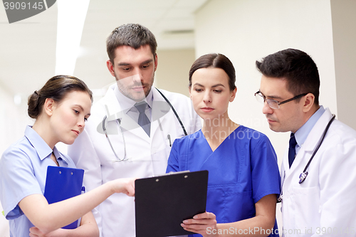 Image of group of medics at hospital with clipboard