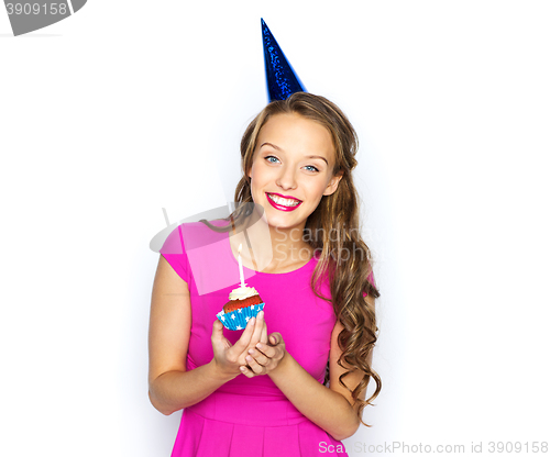 Image of happy woman or teen girl with birthday cupcake