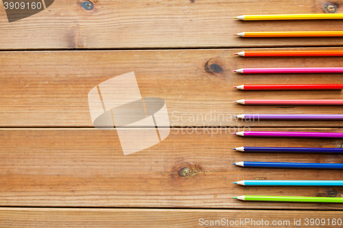 Image of close up of crayons or color pencils on wood