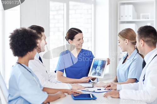 Image of group of happy doctors meeting at hospital office