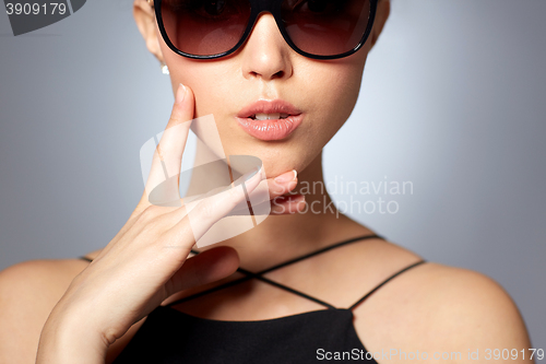 Image of close up of beautiful woman in black sunglasses