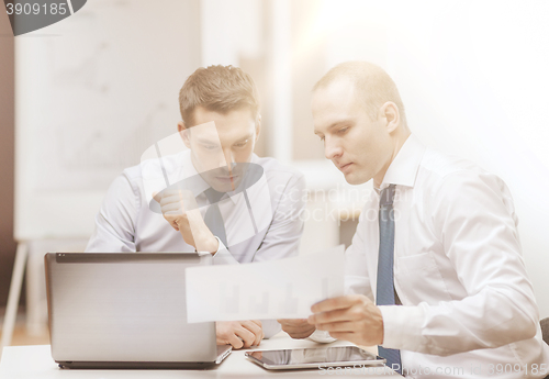 Image of two businessmen having discussion in office