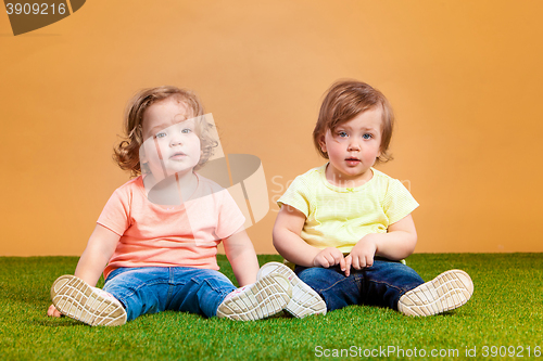 Image of Happy funny girl twins sisters playing and laughing