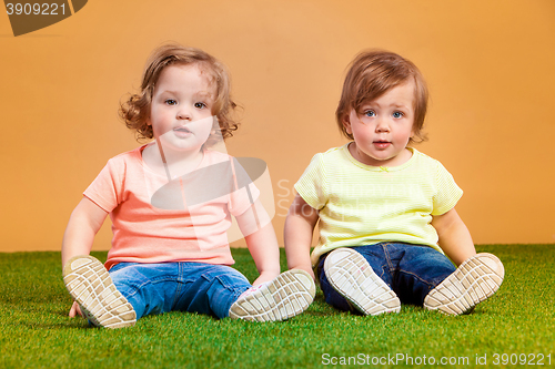 Image of Happy funny girl twins sisters playing and laughing