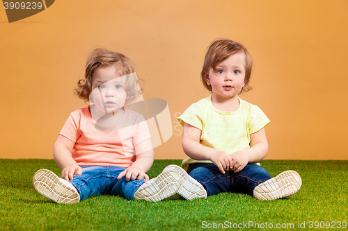 Image of Happy funny girl twins sisters playing and laughing