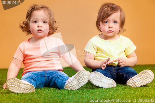 Image of Happy funny girl twins sisters playing and laughing