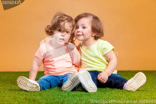 Image of Happy funny girl twins sisters playing and laughing