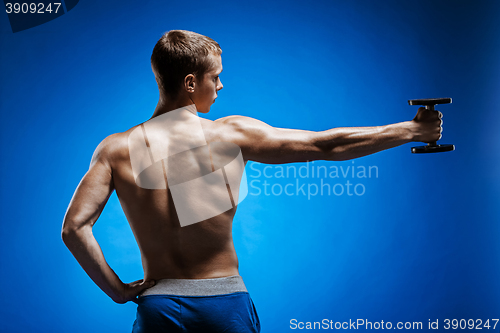 Image of Fit young man with beautiful torso on blue background