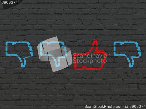 Image of Social network concept: thumb up icon on wall background