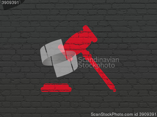 Image of Law concept: Gavel on wall background