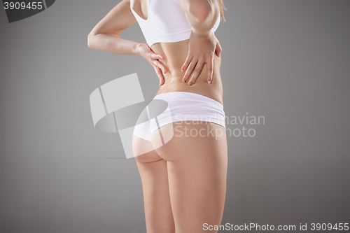 Image of Young, slim, healthy and beautiful woman in white lingerie