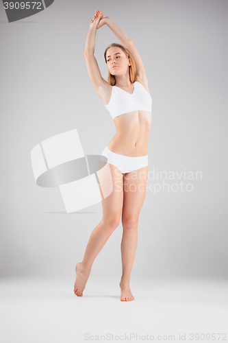 Image of Young, slim, healthy and beautiful woman in white lingerie