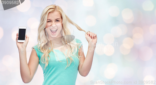 Image of happy young woman or teenage girl with smartphone